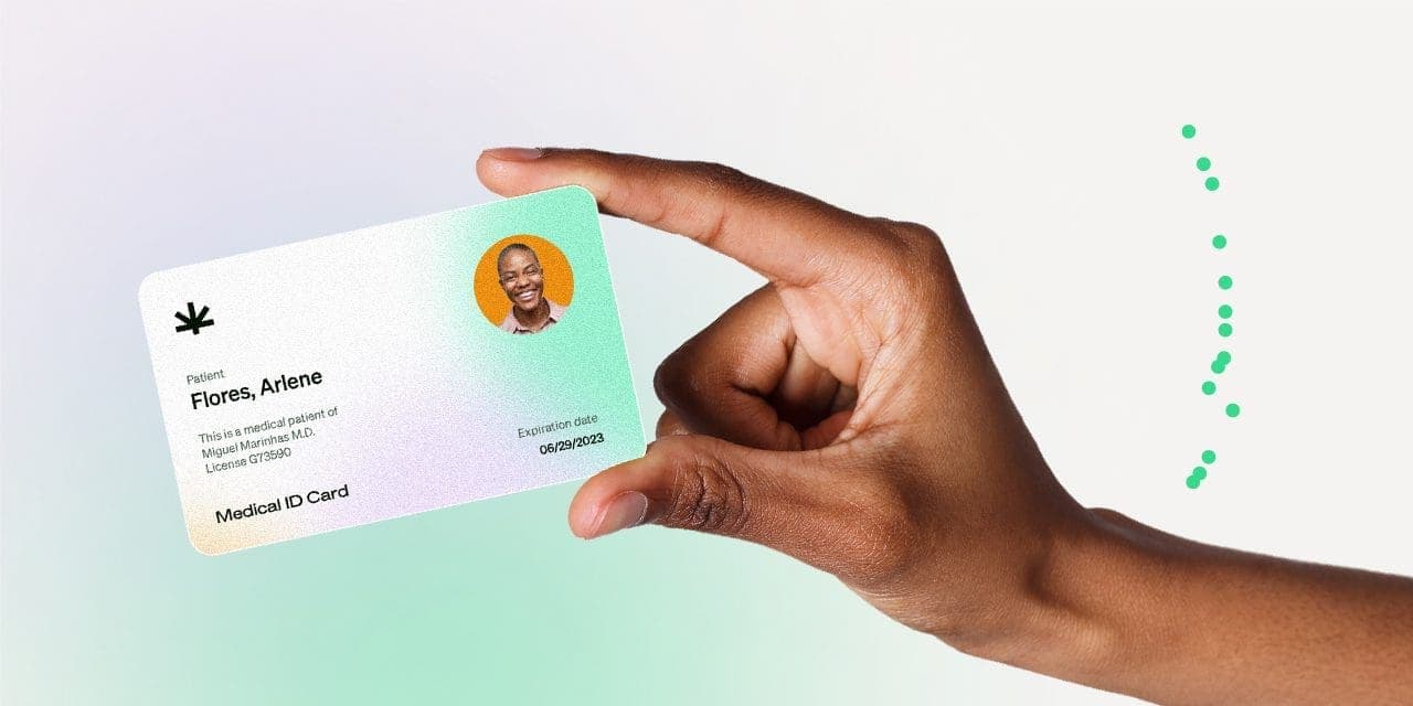 closeup hand holding MMJ card